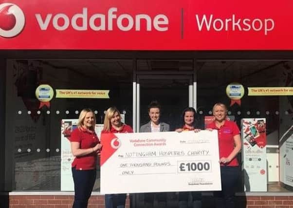 Vodafone present a Â£1,000 award to Nottingham Hospitals Charity.