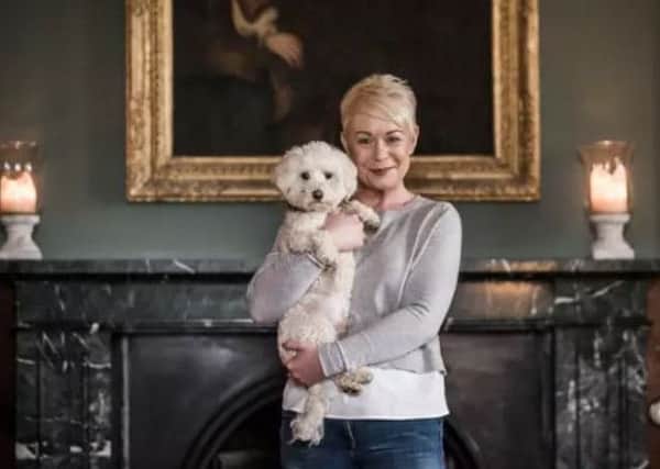 Helen Davies is pictured with her dog Percy.