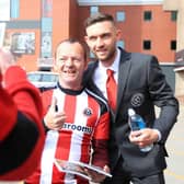 Sheffield United's Jay O'Shea poses for a photograph with a fan