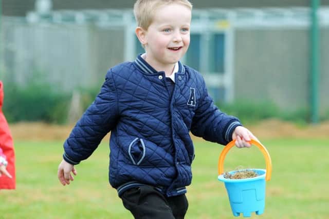 Priory Academy pupil Taylor Poulton takes part in the Peppa Pig puddle walk following a picnic to raise funds for the Wish Upon a Star charity, on Friday.