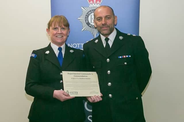 PCSO Sharon Marsh is congratulated by Chief Superintendent Mark Holland