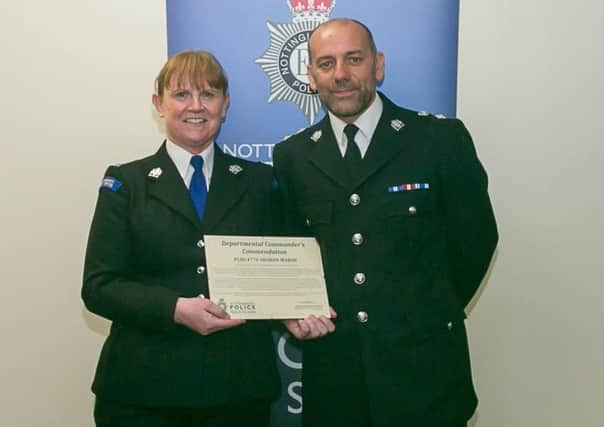 PCSO Sharon Marsh is congratulated by Chief Superintendent Mark Holland
