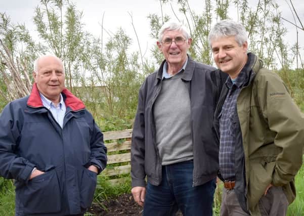 Retford Rotarians Roger Stenson (left) and David Towers with Dom Schad (right) of the Muddy Fork charity. Picture: Di Fisher