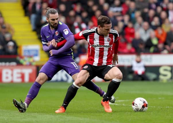 Ricky Holmes of Charlton Athletic in action with Billy Sharp: Jamie Tyerman/Sportimage