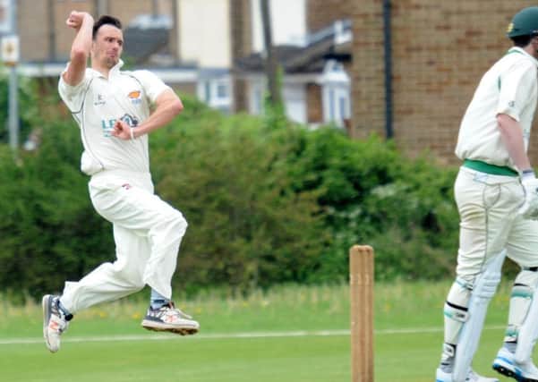 Lewis Bramley in bowling action for Cuckney.