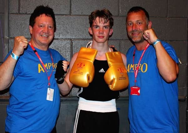 Boxer Marcus Ellis with his club coaches Harry Watson (left) and Mark Curtis (right).