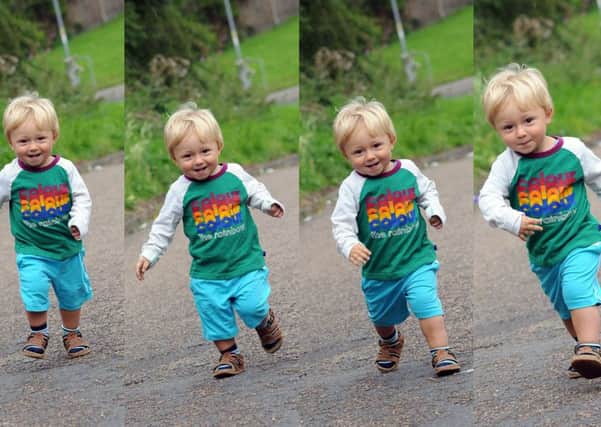 One year old Marshall Tyrell makes progress on his 1 mile walk in aid of JOEL.