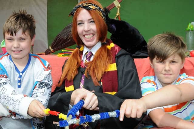 Nevan Birkitt and Malakai Morley practice their spell casting skills during a Harry Potter event at the Marshalls Yard shopping centre in Gainsborough on Friday.