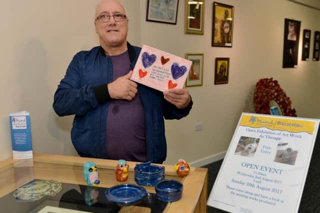 Launch of new exhibition at Worksop Library, artwork designed and produced by members of Bassetlaw MIND, pictured is Ron Smith with his ceramics