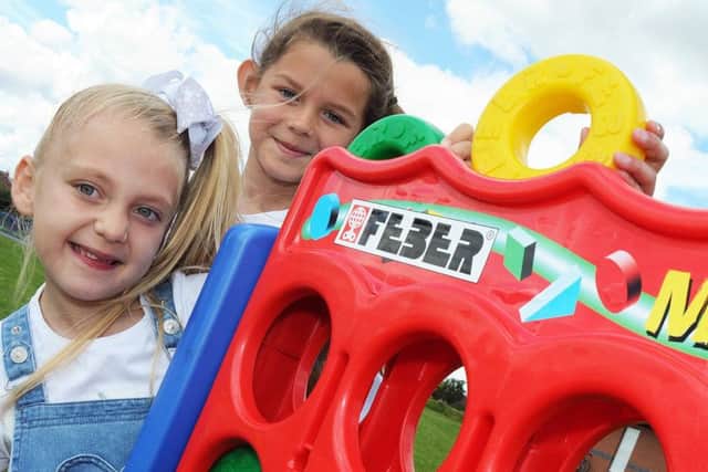 From the Heart fun day.Angel Edward, 6, and Sophie Speed, 8, have a go at connect four at the fun day held at the Manton Community Centre on Saturday.