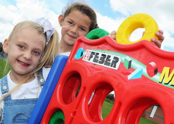 From the Heart fun day.
Angel Edward, 6, and Sophie Speed, 8, have a go at connect four at the fun day held at the Manton Community Centre on Saturday.