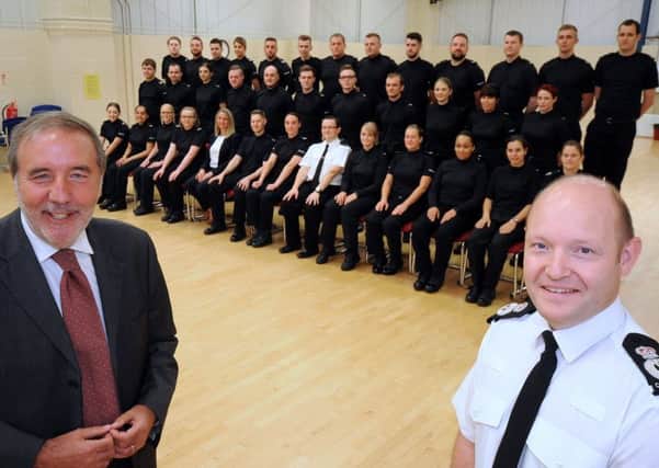 New Nottingham Police recruits line up with the Chief Constable, Craig Guildford, right,and Nottinghamshire's Police and Crime Commissioner Paddy Tipping, left, and constables, Alastair Roper and Lisa Davies.