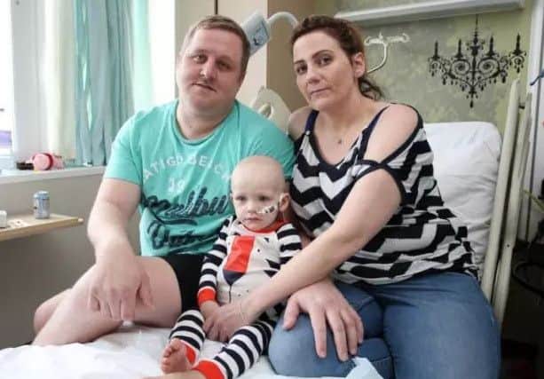Dawson Willcock in hospital with parents David and Wendy. Photo: Joseph Raynor.