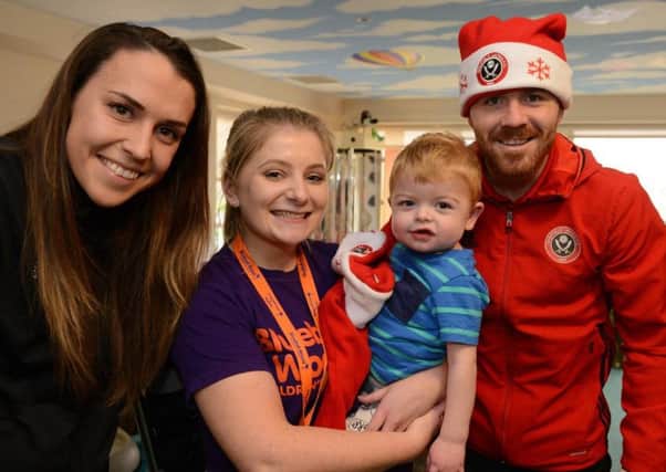 Sheffield United Ladies captain Rosa Neary and John Fleck during a Christmas visit to Bluebell Wood