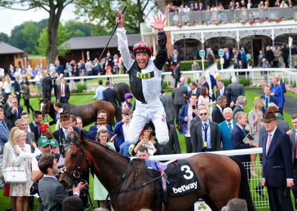 Cracksman and jockey Frankie Dettori, showing off his trademark flying dismount, who were the stars of the show on Qipco British Champions Day at Ascot. (PHOTO BY: Simon Hulme, Yorkshire Post Newspapers)
