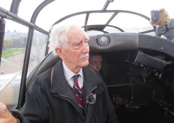 RAF veteran Eddie Humes tours a restored Lancaster Bomber.