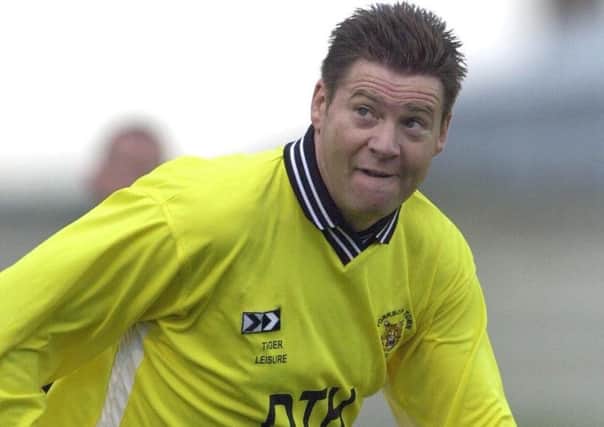 Chris Waddle making his debut for Worksop Town at Sandy Lane against Rotherham United in a pre-season friendly in 2000.