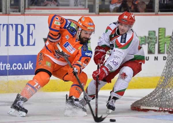 Mathieu Roy battles for possession around the Cardiff Devils' goal