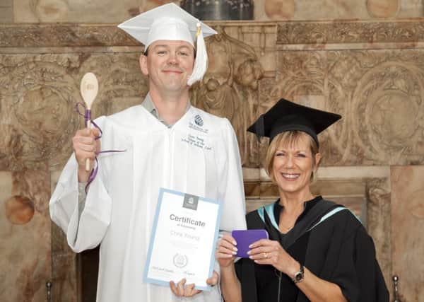 Chris Young with his Fellowship award, together with graduate Julie Byrne, Picture: John Bradley