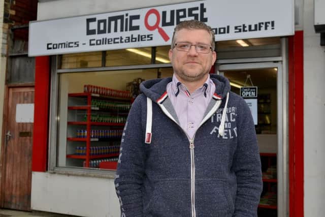 Adam Hall pictured in his new shop on Hardy Street, Comic Quest