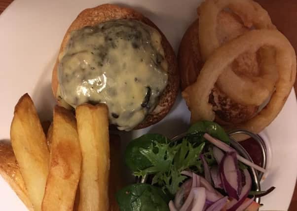 The award-winning Derbyshire steak burger which came with onion rings, dressed salad and chips at the Elm Tree at Elmton in Derbyshire