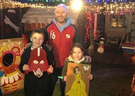 Tony pictured with two of Karen Land's children Sam, eight, and Ruby, six.
