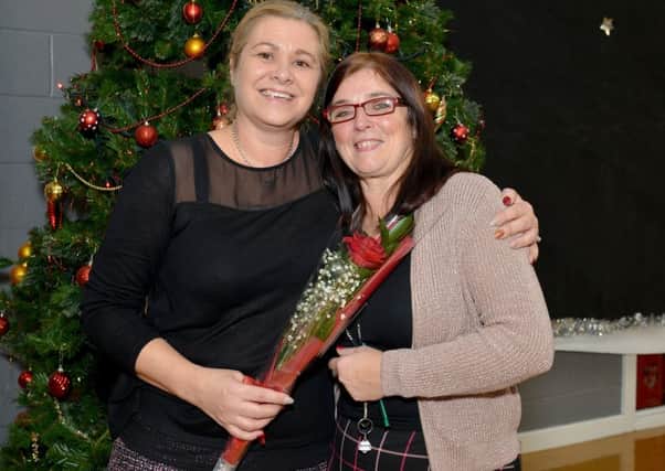 Guardian Rose presentation to Joanne Maddison at Redlands Primary School,  Joanne is pictured left recieving her rose from Sonia Batty