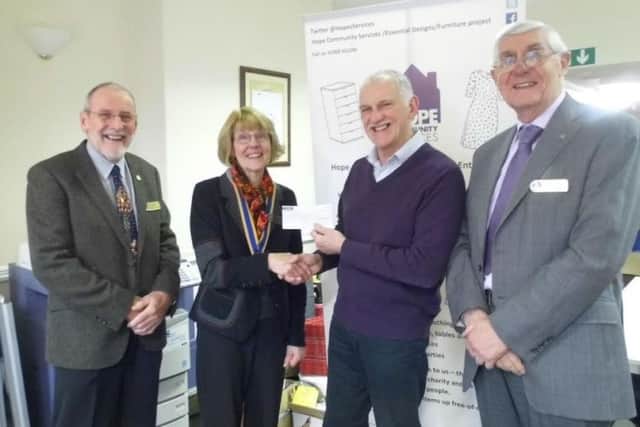 A cheque is presented to HOPE CEO Alan Diggles.