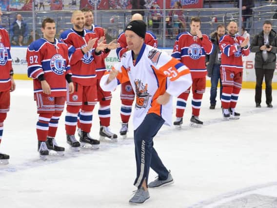 Mark Matheson entertains the Minsk team as he 'skates' to receive his award