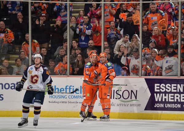 Andreas Valdix and Eric Neiley celebrate on Saturday at the Arena