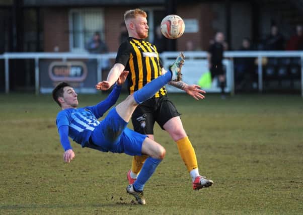 Worksop Town v Staveley Miners Welfare.
The Tiger's Alec Denton rides a defensive challenge to go on and score in the 25th minute at Sandy Lane on Saturday.