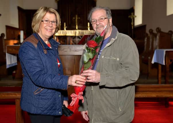 Guardian Rose presentation to Robert Glassey, Robert is presented with his rose from Catherine Gilfillan