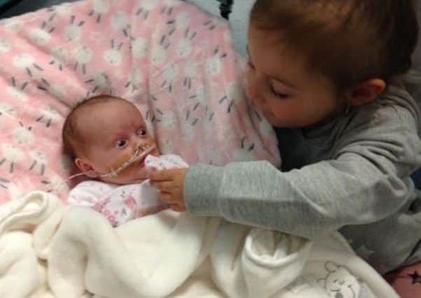 Bonnie Rose with her sister, Mary Anne.