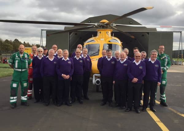Members of the Belvoir Wassailers wtth the Lincs & Notts Air Ambulance crew
