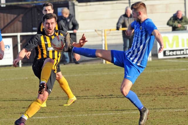 Worksop Town v Staveley Miners Welfare.
The Tiger's Conor Higginson is challenged by Jack Turnbull.