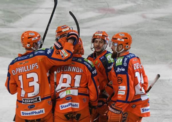 Steelers' players celebrate a goal from top point scorer and defenceman Ben O'Connor