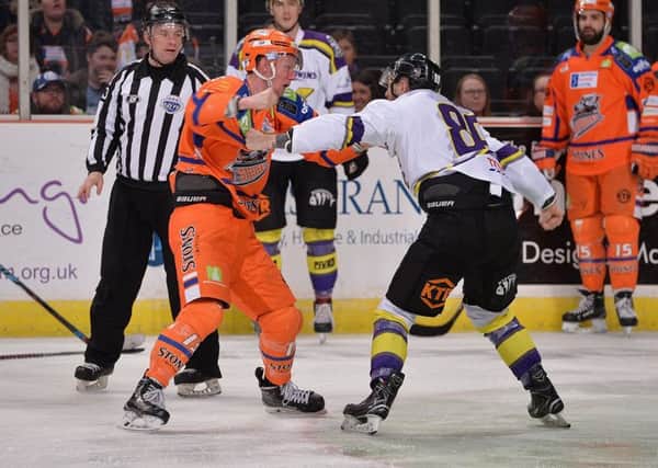Davey Phillips fights a Manchester Storm opponent