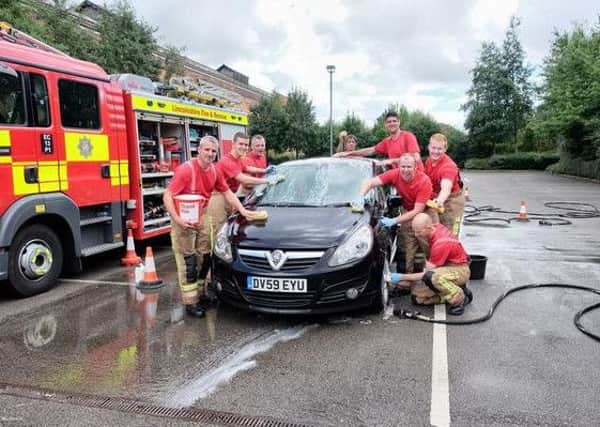 Firefighters charity car wash in Gainsborough