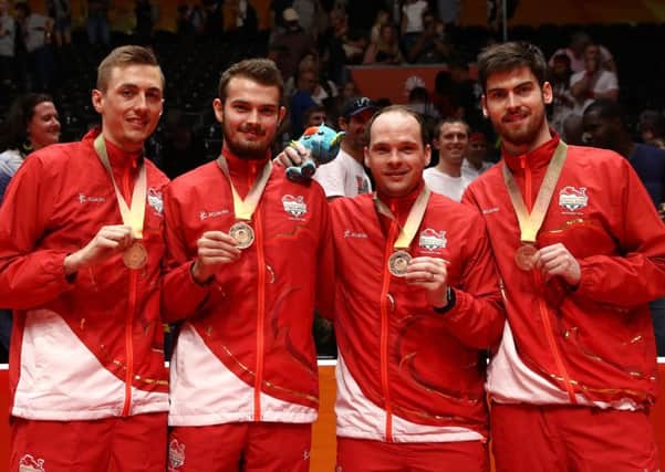 England show the table-tennis bronze medals they have won at the 2018 Commonwealth Games on the Gold Coast in Australia.  PHOTO BY: Robert Cianflone/Getty Images)