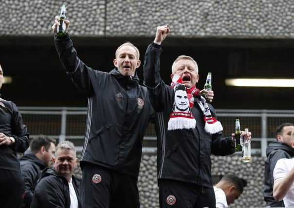 Chris Wilder (right) hopes to be celebrating again after his 100th game in charge of Sheffield United: Simon Bellis/Sportimage