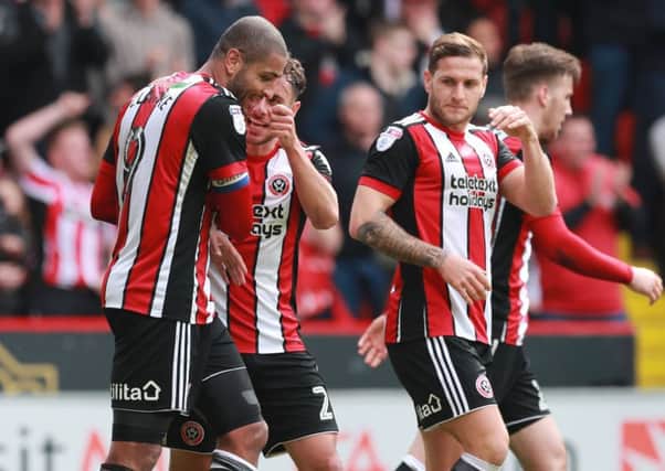 Leon Clarke (left) is congratulated on yet another goal: Simon Bellis/Sportimage