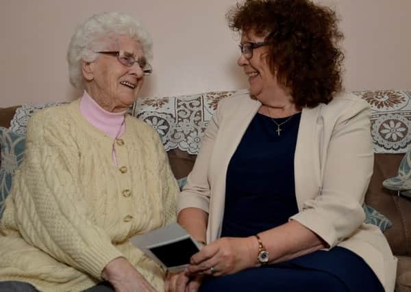 Bassetlaw District Council Chairman Madelaine Richardson reminiscing with her Great Aunt 100 year old Dot Finch