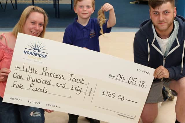 Four year old fundraiser Cruz Denbigh with parents Carla Pendleton and Liam Lawrence
