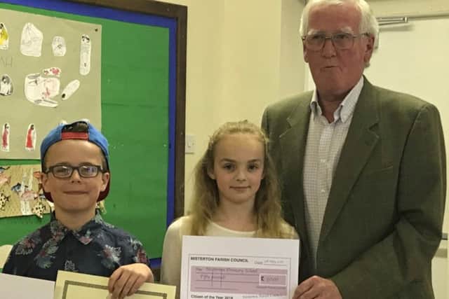 Seth and Emily receive the Under-18s Misterton Citzen of the Year Award on behalf of year six at Misterton Primary School from Coun Peter Marsden, chairman Misteron Parish Council