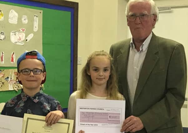 Seth and Emily receive the Under-18s Misterton Citzen of the Year Award on behalf of year six at Misterton Primary School from Coun Peter Marsden, chairman Misteron Parish Council