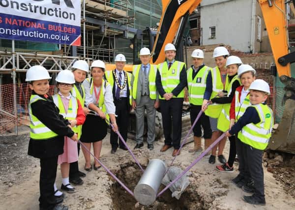 The topping out ceremony of the new Travelodge development in Gainsborough. Pupils from The Gainsborough Parish Church School helped to bury a time capsule.