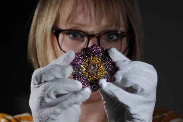 25 May 2018.......... A new exhibition by world renowned jeweller JAR has opened at The Portland Collection at The Welbeck Estate in north Notts. The gallery's Rebecca Hardy with one of JAR's creations.Picture Scott Merrylees