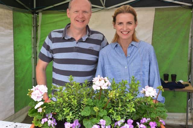 Katie Rushworth with Michael Smith who won the garden containers she made in her gardening demonstrations.