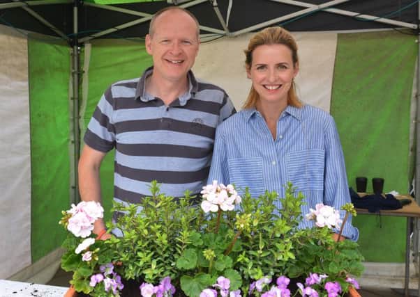 Katie Rushworth with Michael Smith who won the garden containers she made in her gardening demonstrations.